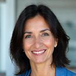 Portrait of Dr. Evelyn Reed, a smiling woman in her 40s.
